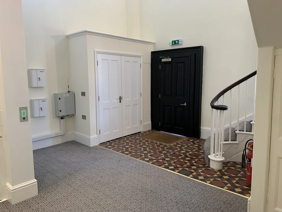 Entrance hall with internal door and staircase at Milford Hill House