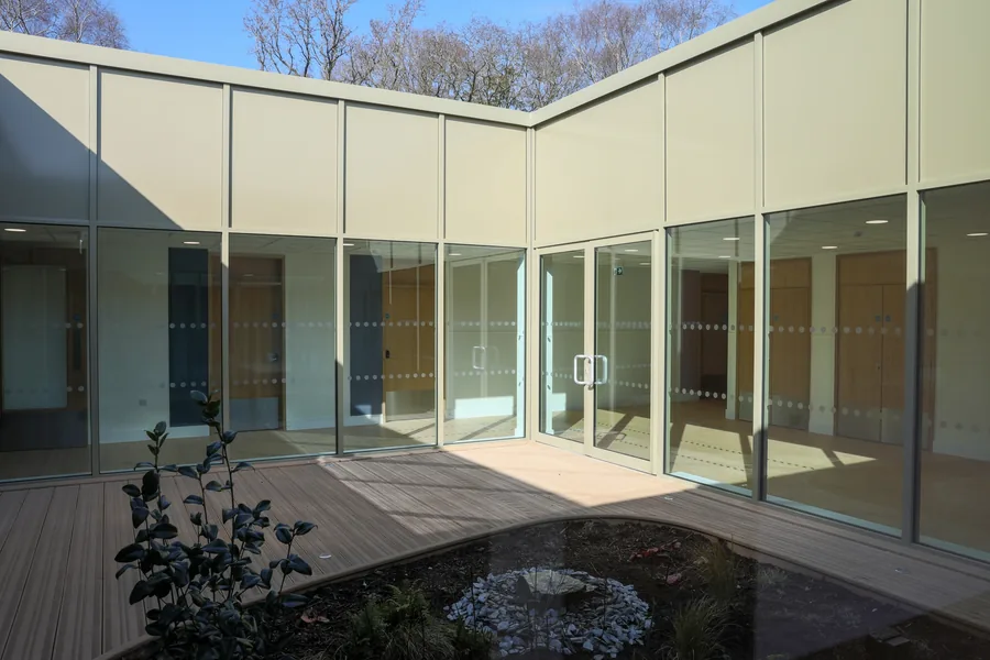Internal glazed courtyard with timber decking