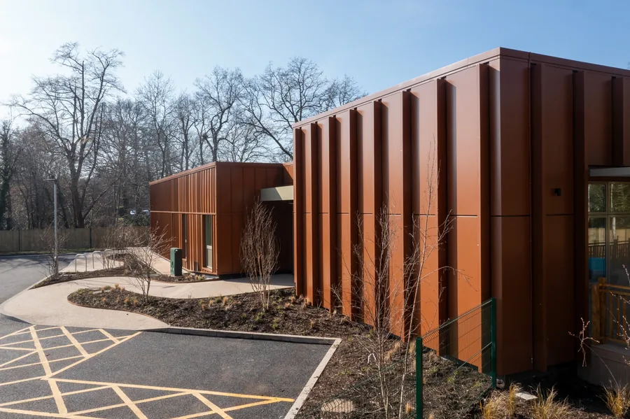 Vertical weathering-steel cladding on the respite centre